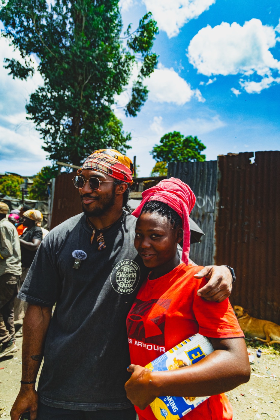Participant standing with a community member