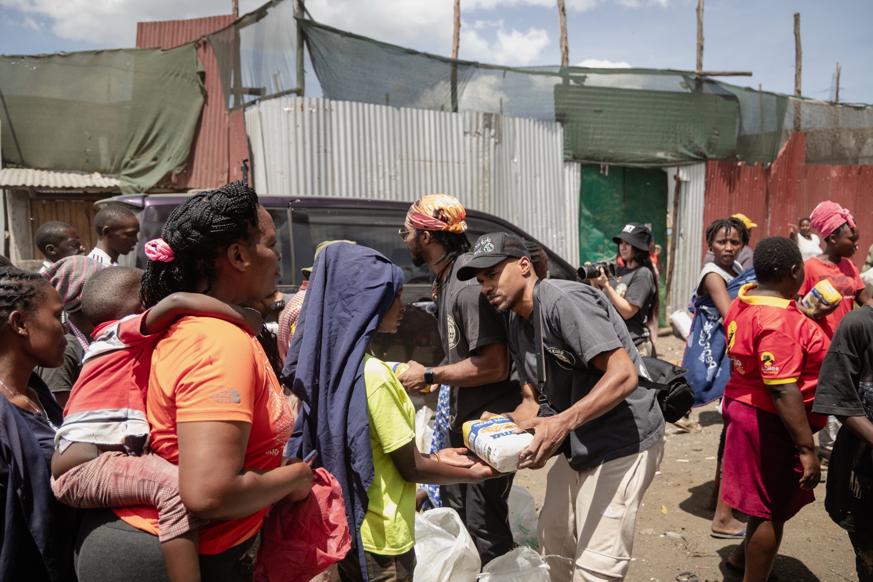 Travelers serving alongside a local community